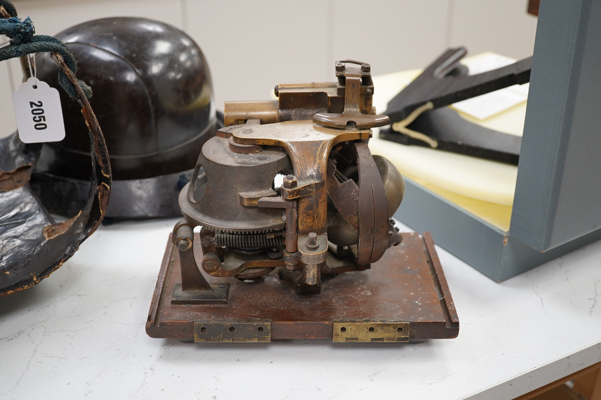 A First World War torpedo gyroscope, stamped 2878 W&Co. top part of the wooden case missing, 21cm high x 24cm wide. Condition - some general wear and damage, unknown if in working order.